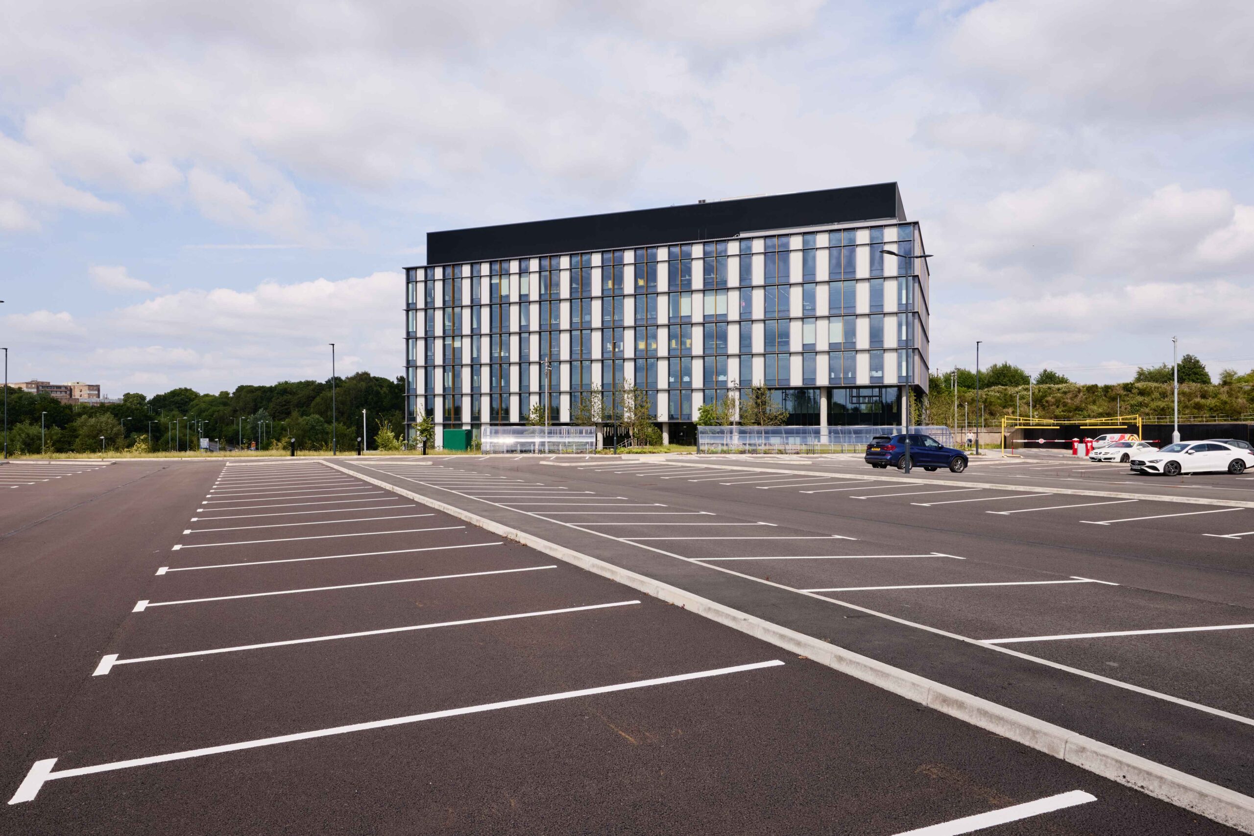 bhic external and car park car park for laboratory building in birmingham with large multi floor building in the background