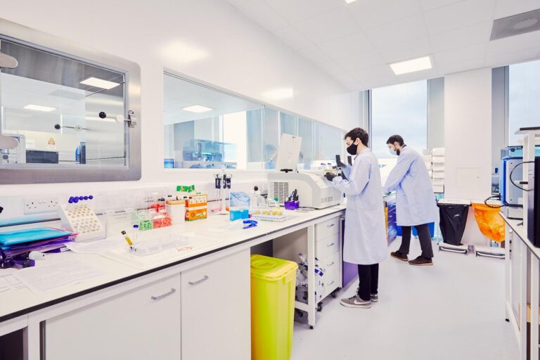 Two men in lab coats working in laboratory