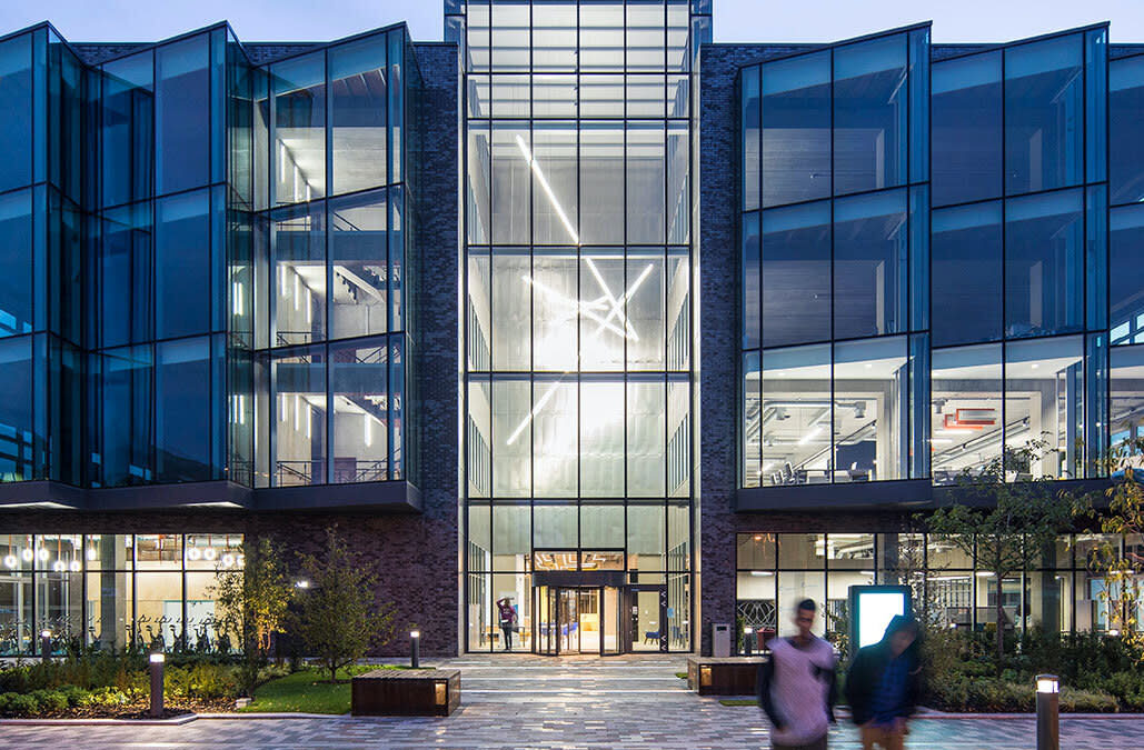 large glass building in the evening light